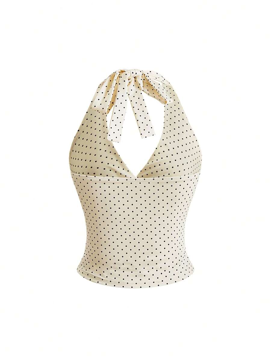 Women's halter crop tank top featuring a backless silhouette and ruched detailing in a slim fit design.