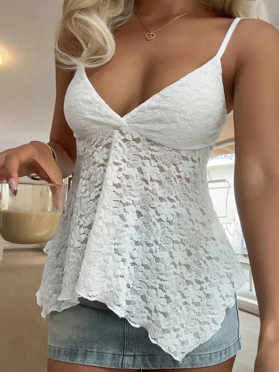 Women's white deep V-neck lace cami top featuring thin straps, semi-sheer lace fabric, and an asymmetrical hemline.