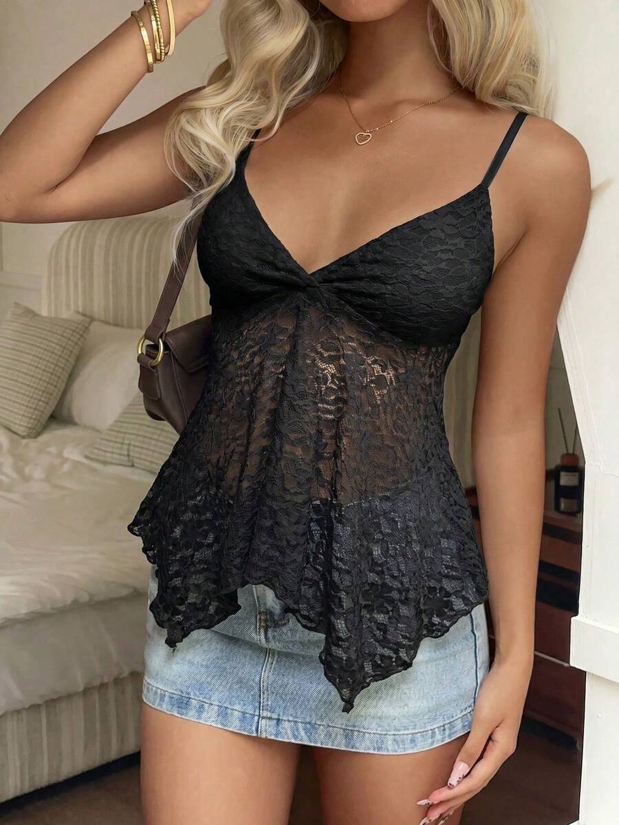 Women's white deep V-neck lace cami top featuring thin straps, semi-sheer lace fabric, and an asymmetrical hemline.