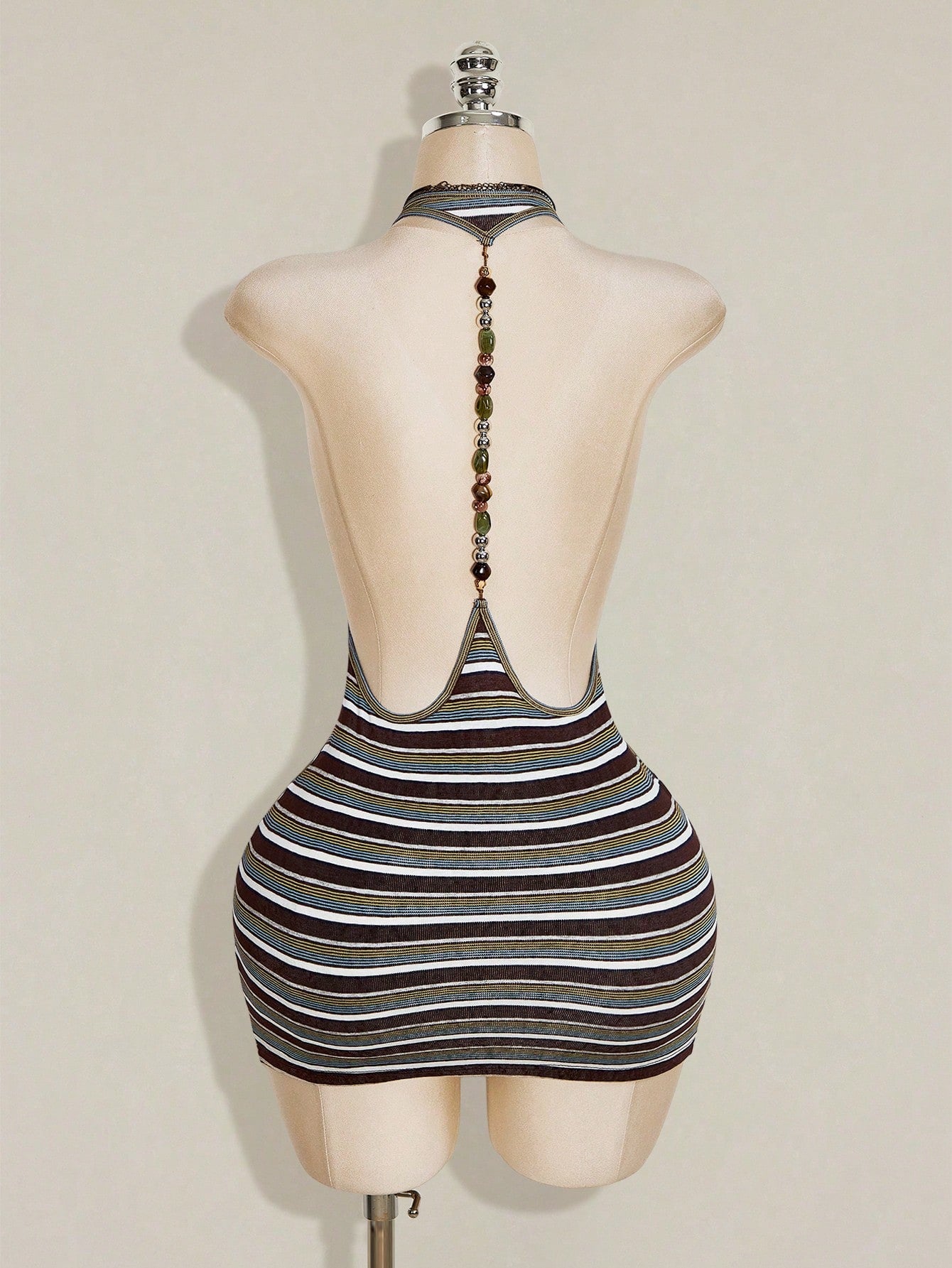 Apricot criss-cross backless bodycon mini dress for women featuring a round neck and rhinestone accent details.