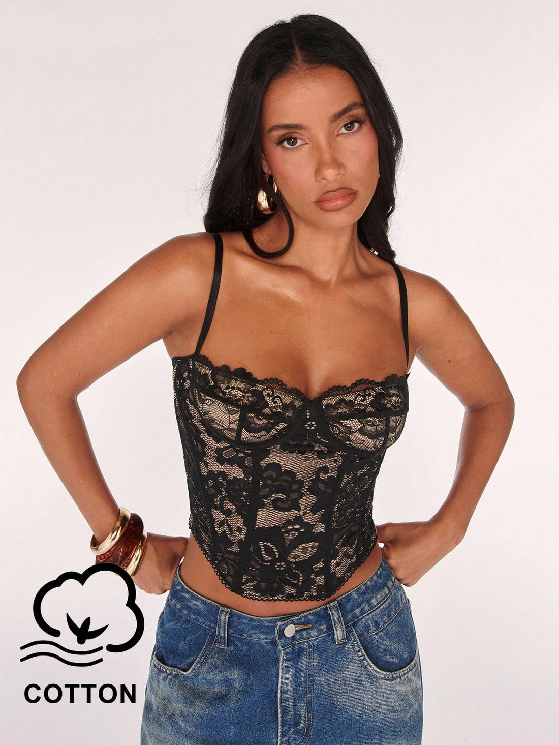Women’s camisole top with cup detail, spaghetti straps, lined body, and slim fit design in knitted fabric with an asymmetrical hem.
