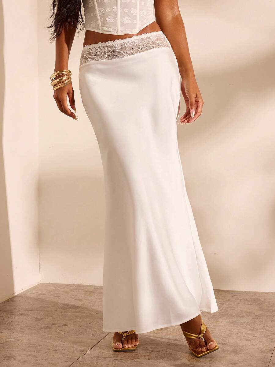 Women's black woven mermaid maxi skirt featuring a solid color design, mid waist, and 100% cotton fabric.
