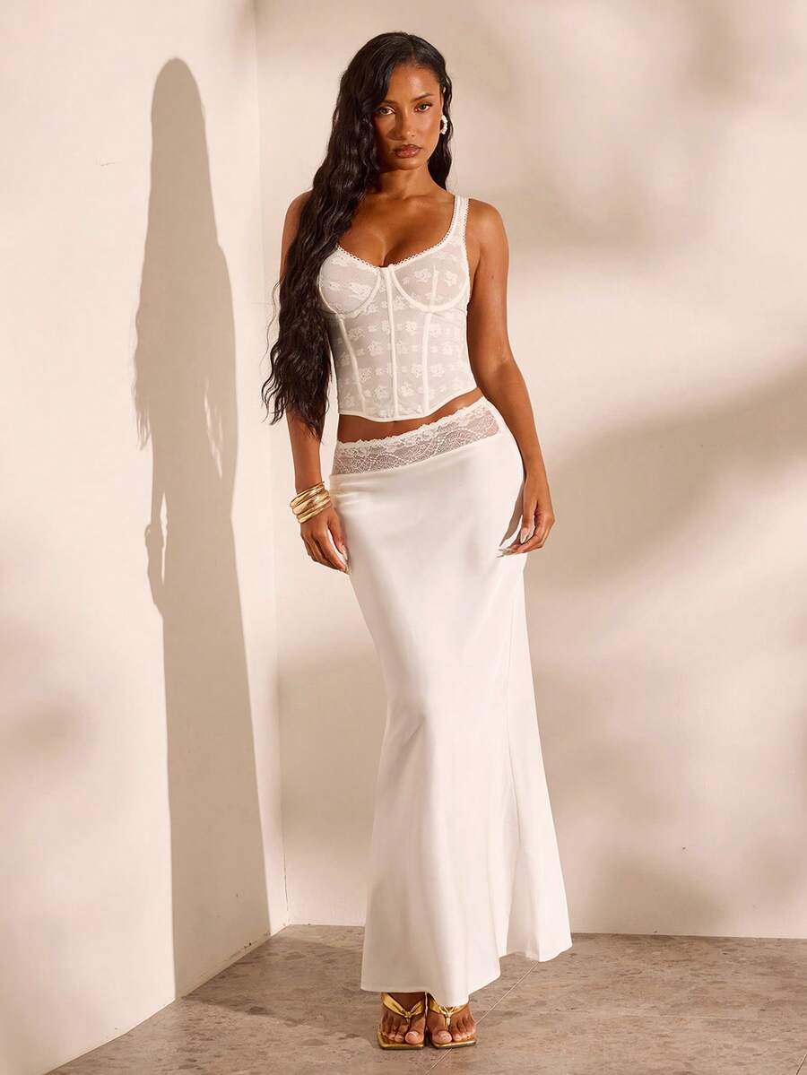 Women's black woven mermaid maxi skirt featuring a solid color design, mid waist, and 100% cotton fabric.