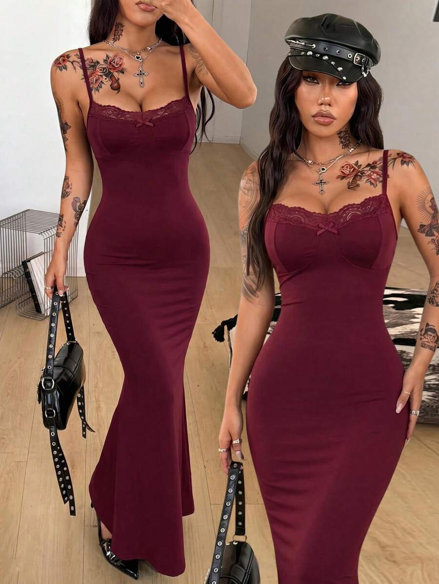 Black backless cami midi dress for women featuring spaghetti straps, slim fit mermaid silhouette, backless button detail, and high stretch knitted fabric.