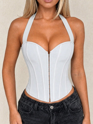 White Y2K halter backless corset top featuring lace-up back detail and metal grommet eyelets for women
