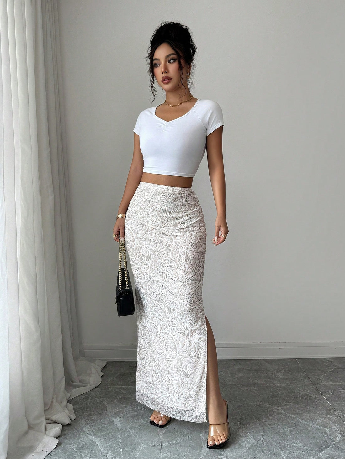 Women's long side slit skirt in plant print pattern featuring a mid-waist cut and knitted stretch fabric.