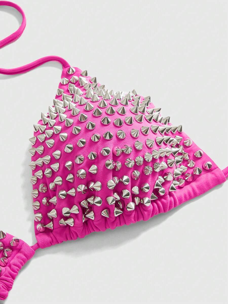 Black studded halter bikini top featuring a backless lace-up design, rhinestone accents, and high-stretch knitted fabric.