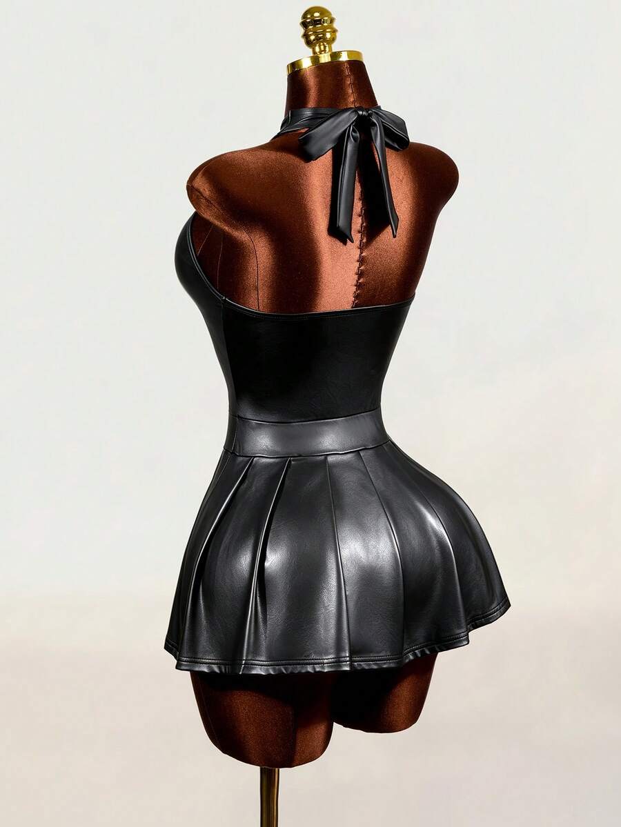 Black halter mini dress with cold shoulder design, contrast mesh detail, and flared A-line hem.