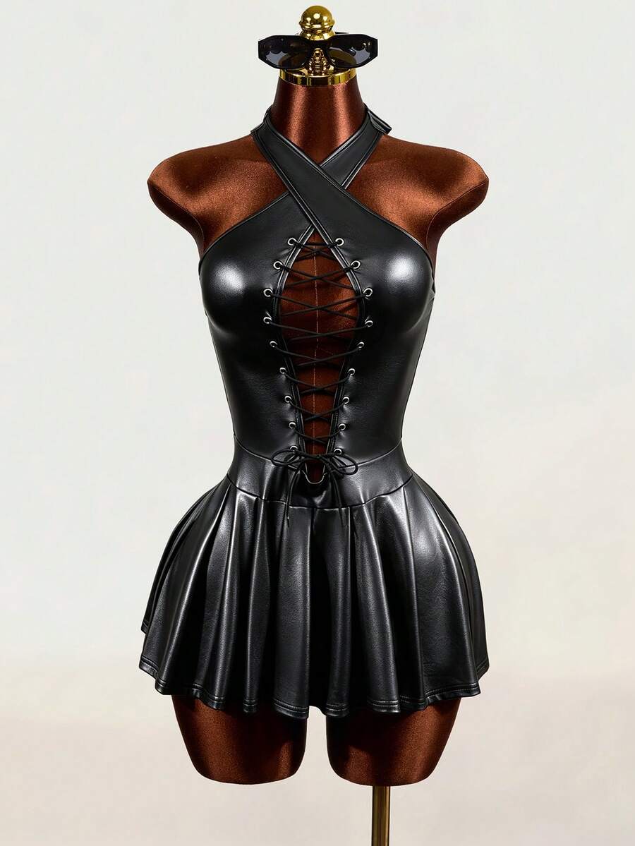 Black halter mini dress with cold shoulder design, contrast mesh detail, and flared A-line hem.