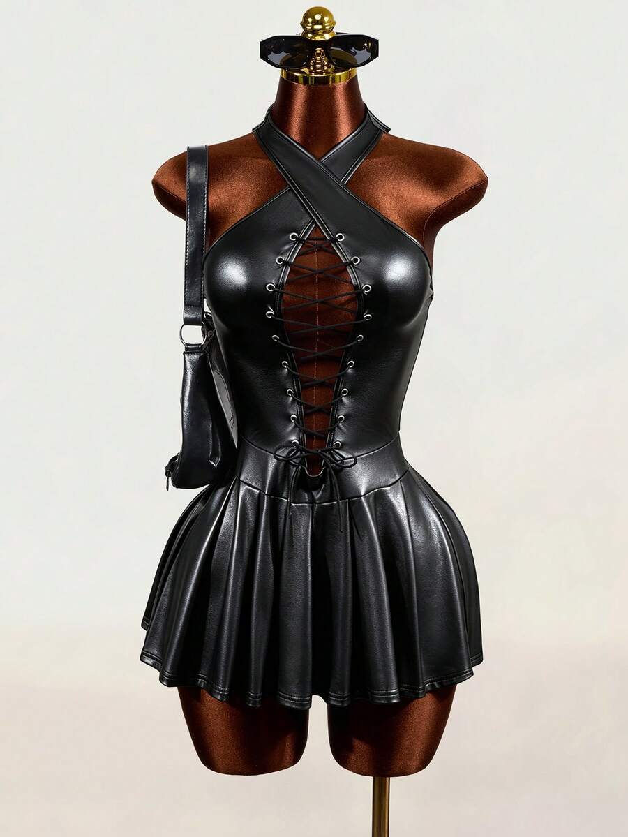 Black halter mini dress with cold shoulder design, contrast mesh detail, and flared A-line hem.