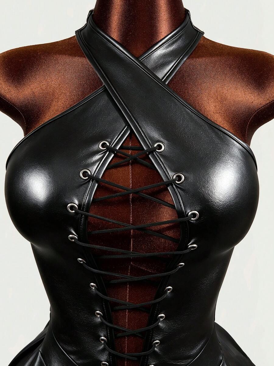 Black halter mini dress with cold shoulder design, contrast mesh detail, and flared A-line hem.