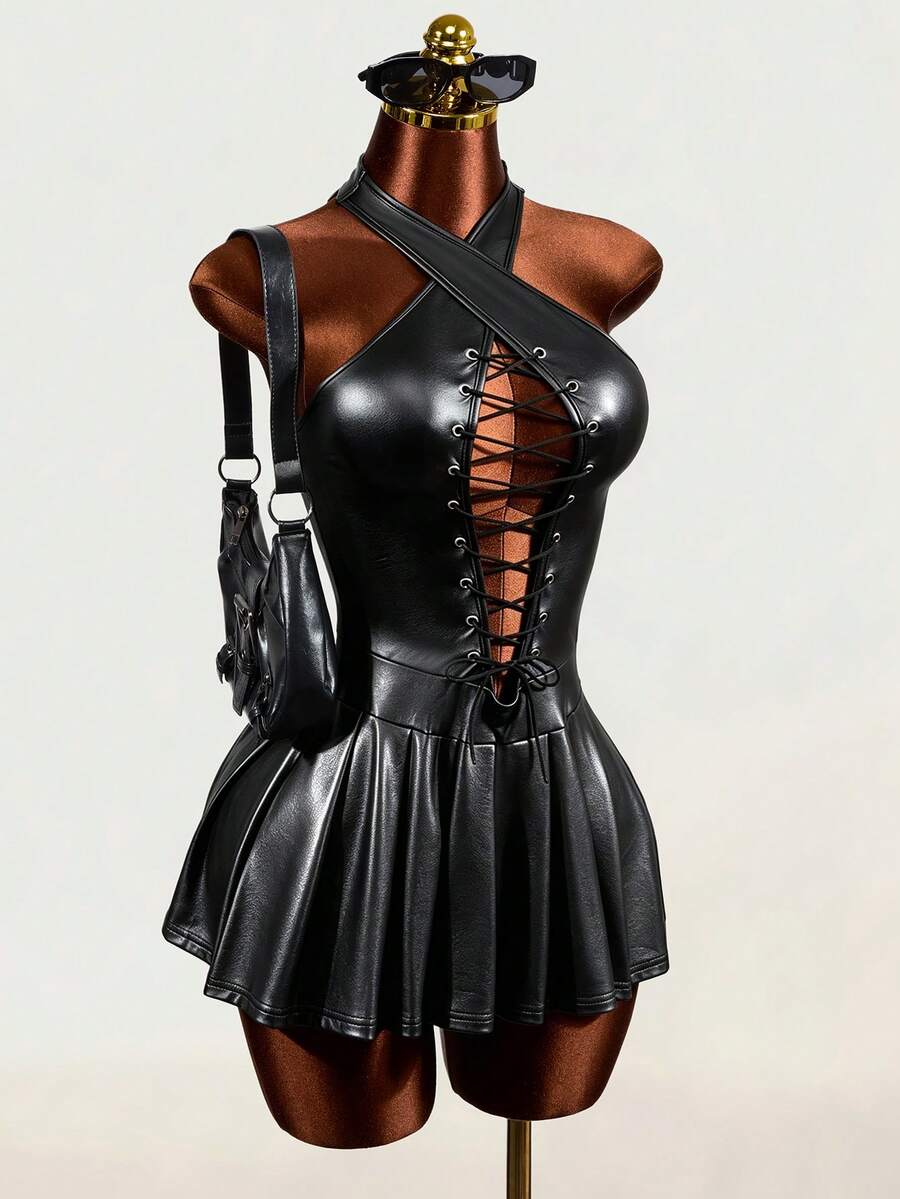 Black halter mini dress with cold shoulder design, contrast mesh detail, and flared A-line hem.