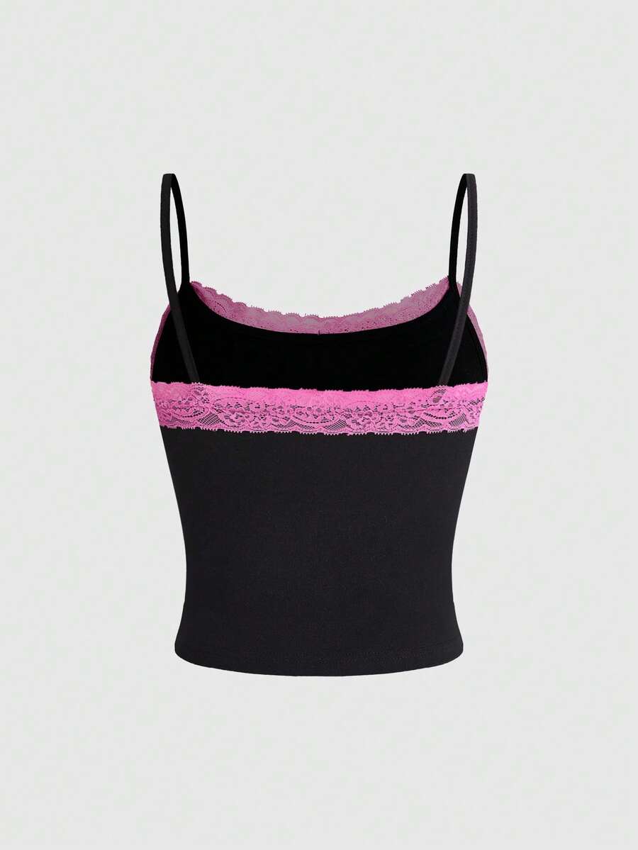 Black women's micro crop cami top featuring graphic crown print, contrast lace trim, bow detail, and spaghetti straps.