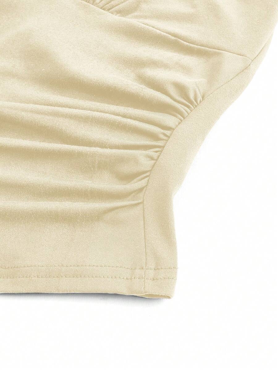 Women's halter crop tank top featuring a backless silhouette and ruched detailing in a slim fit design.