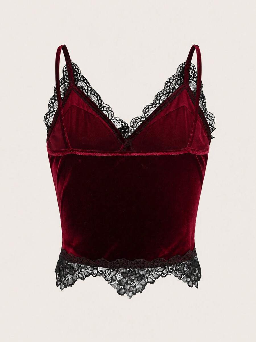 Black gothic velvet crop tank top for women featuring contrast lace trim, bow accent, spaghetti straps, and a metal cross detail.