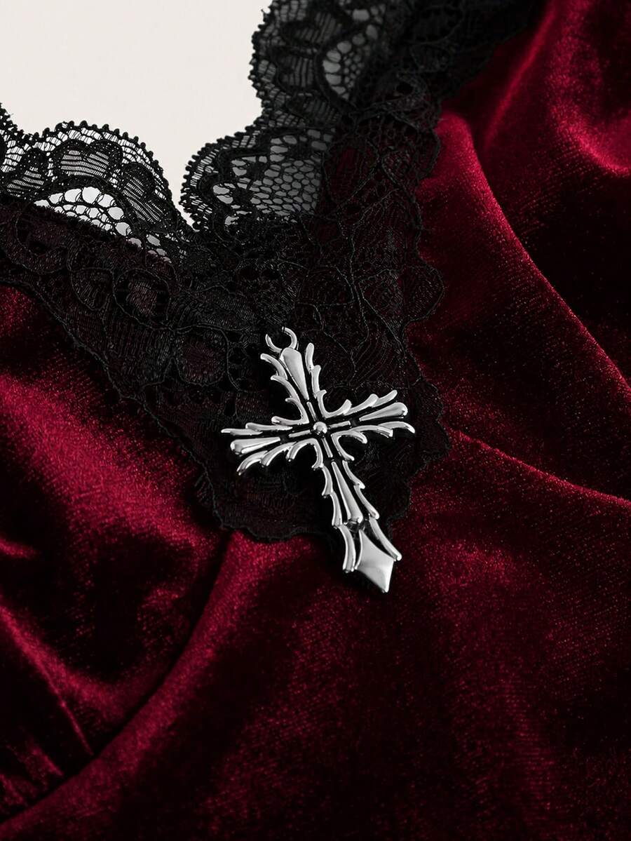 Black gothic velvet crop tank top for women featuring contrast lace trim, bow accent, spaghetti straps, and a metal cross detail.