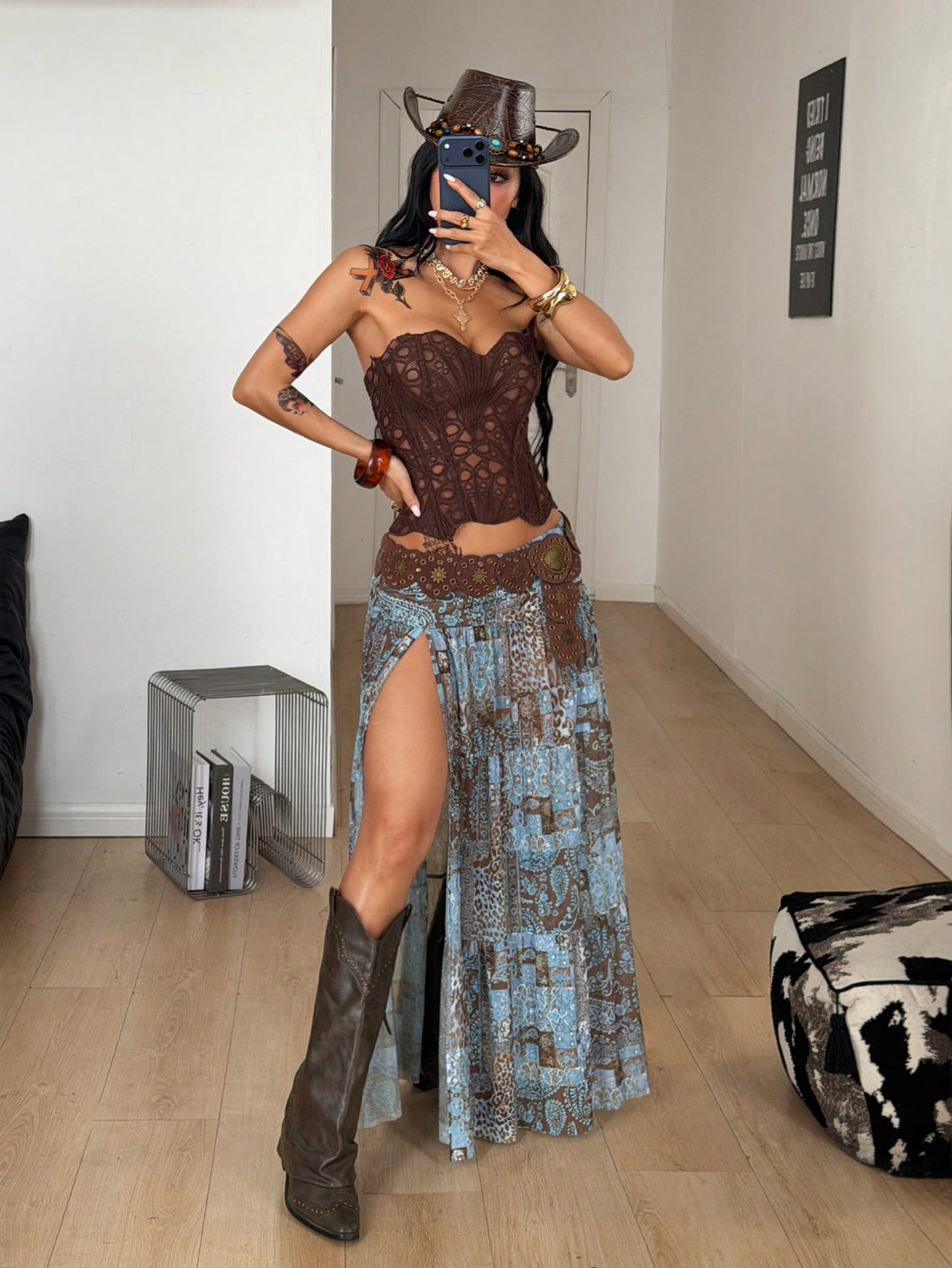 Women's blue and brown graphic print long flared skirt with low waist, split thigh detail, and textured semi-sheer fabric.