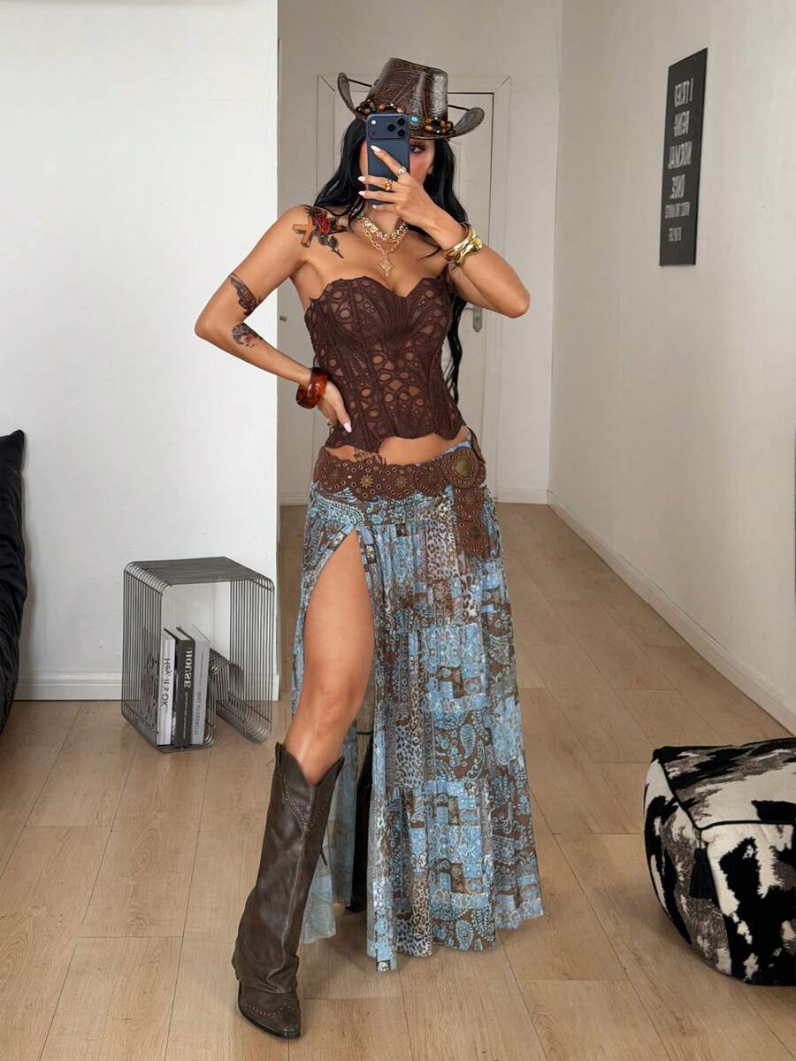 Women's blue and brown graphic print long flared skirt with low waist, split thigh detail, and textured semi-sheer fabric.