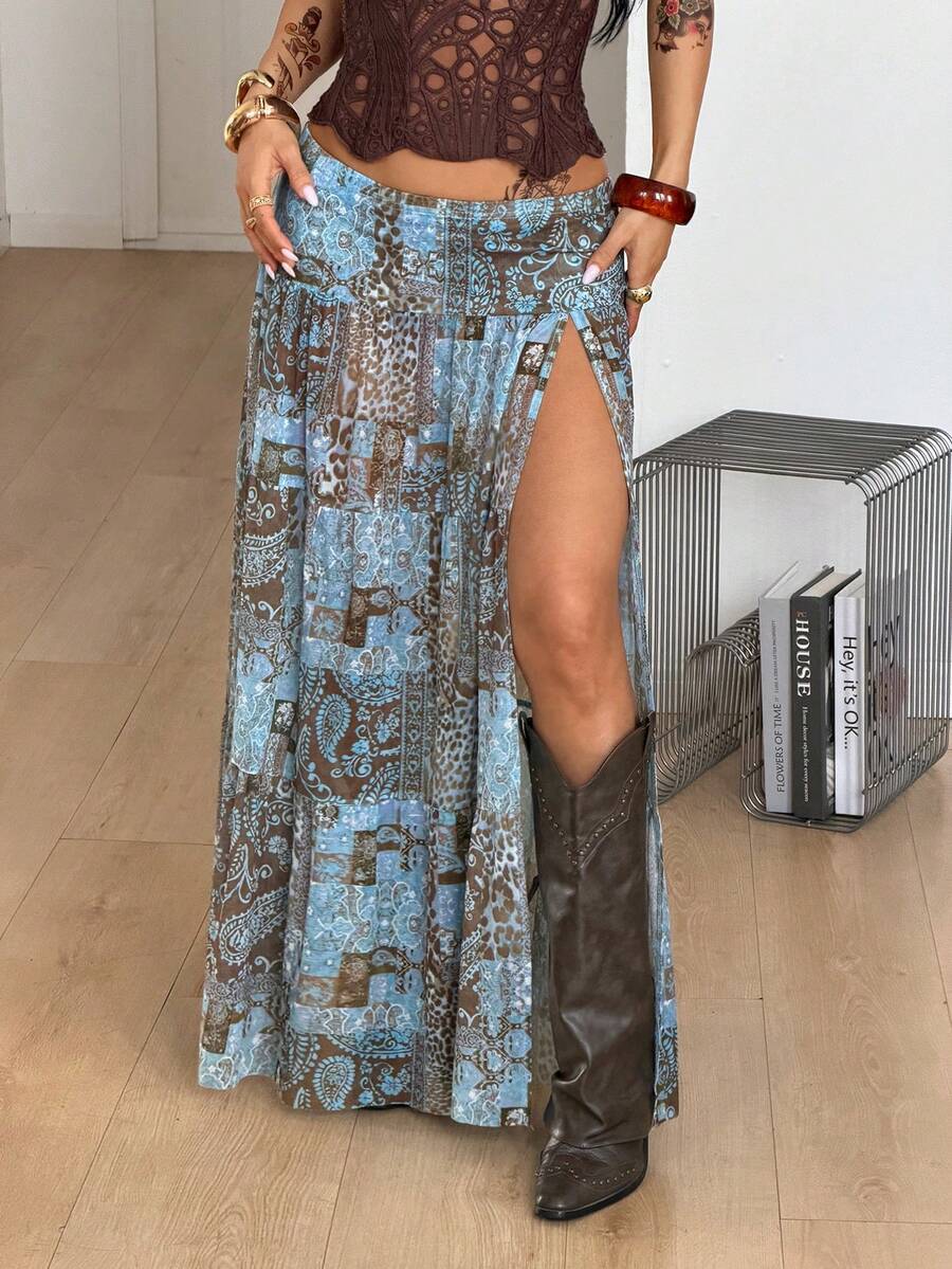 Women's blue and brown graphic print long flared skirt with low waist, split thigh detail, and textured semi-sheer fabric.