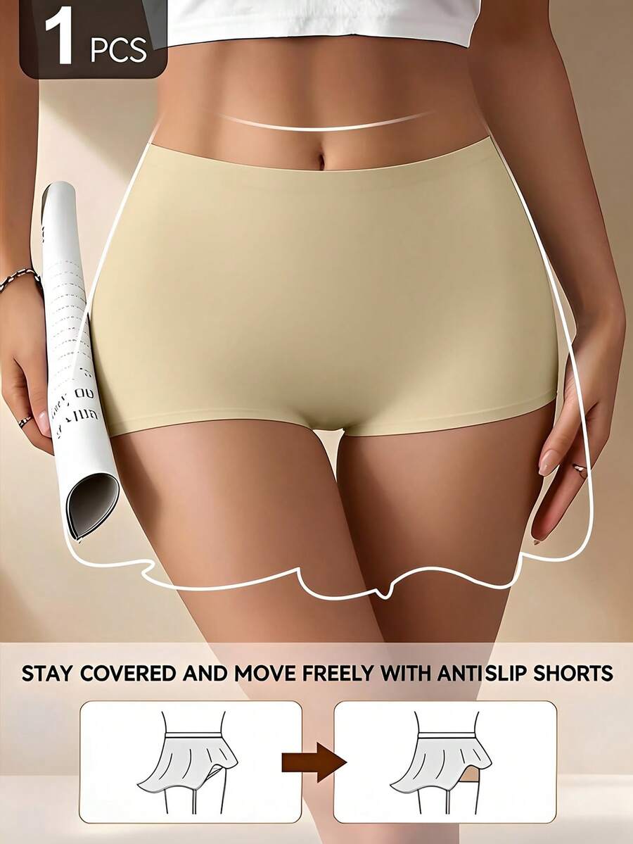 Women's black high stretch shapewear shorts with a mid waist fit and semi-sheer fabric.