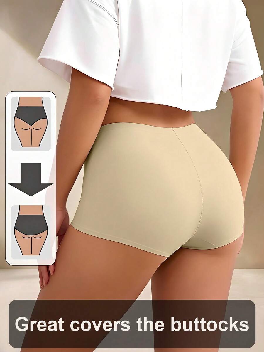 Women's black high stretch shapewear shorts with a mid waist fit and semi-sheer fabric.