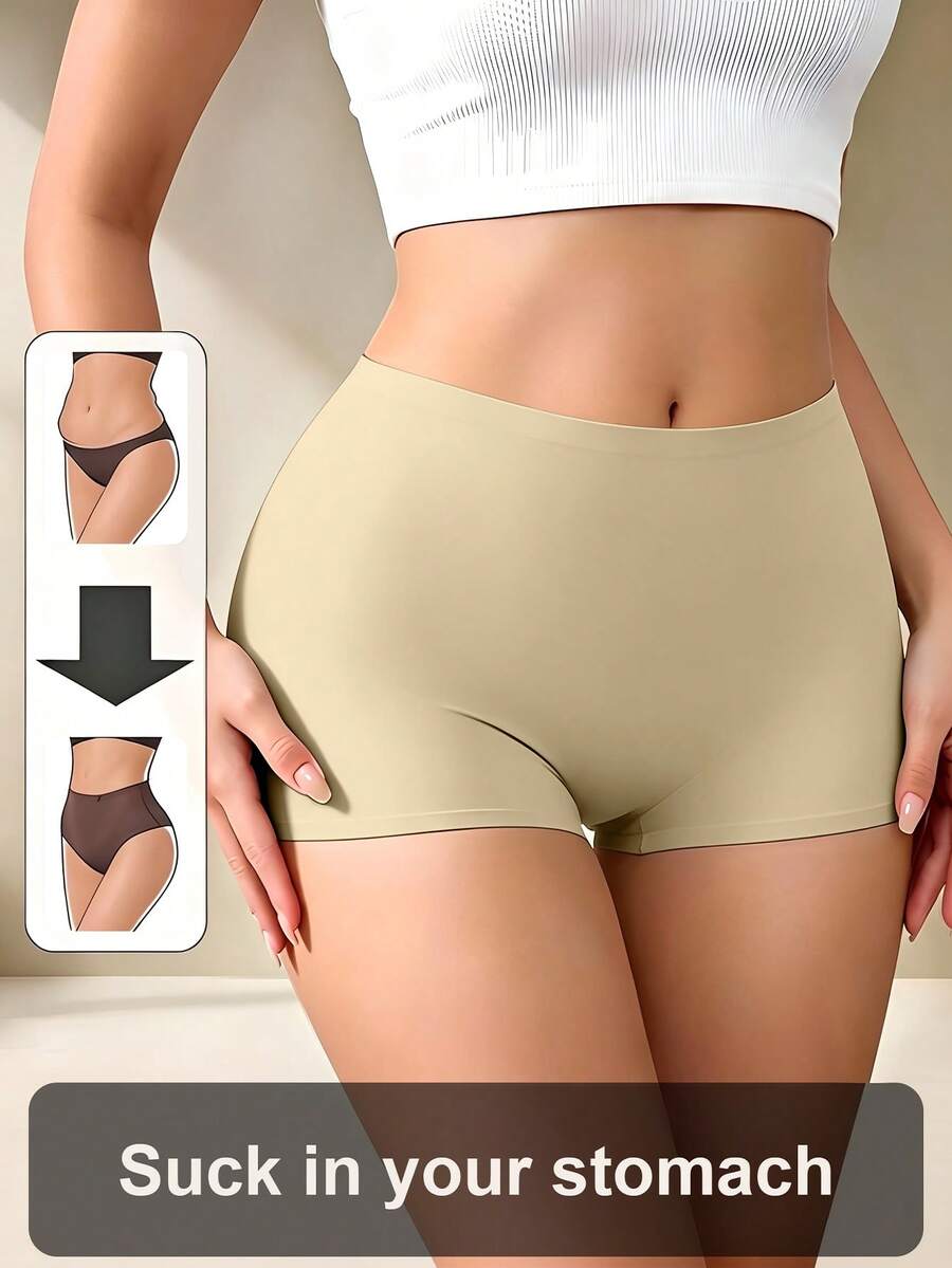 Women's black high stretch shapewear shorts with a mid waist fit and semi-sheer fabric.