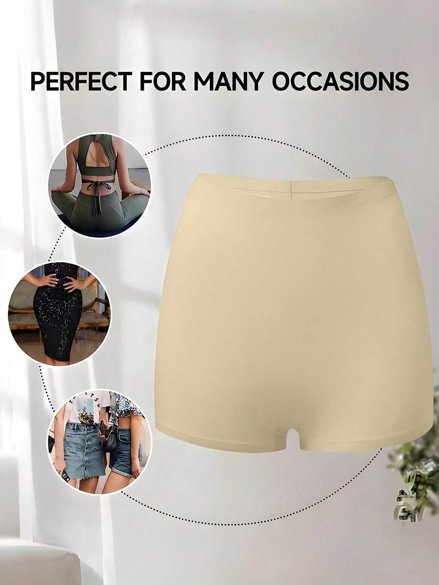 Women's black high stretch shapewear shorts with a mid waist fit and semi-sheer fabric.