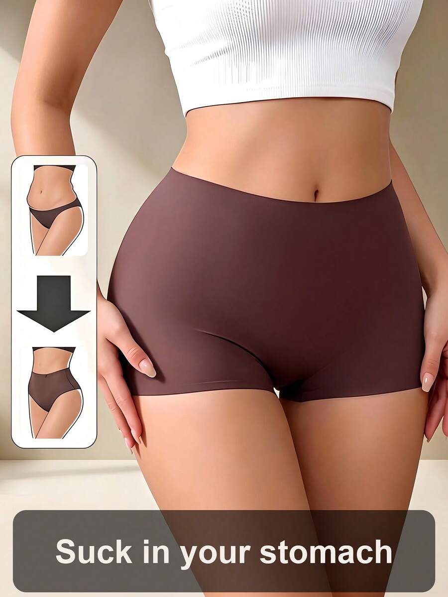 Women's black high stretch shapewear shorts with a mid waist fit and semi-sheer fabric.