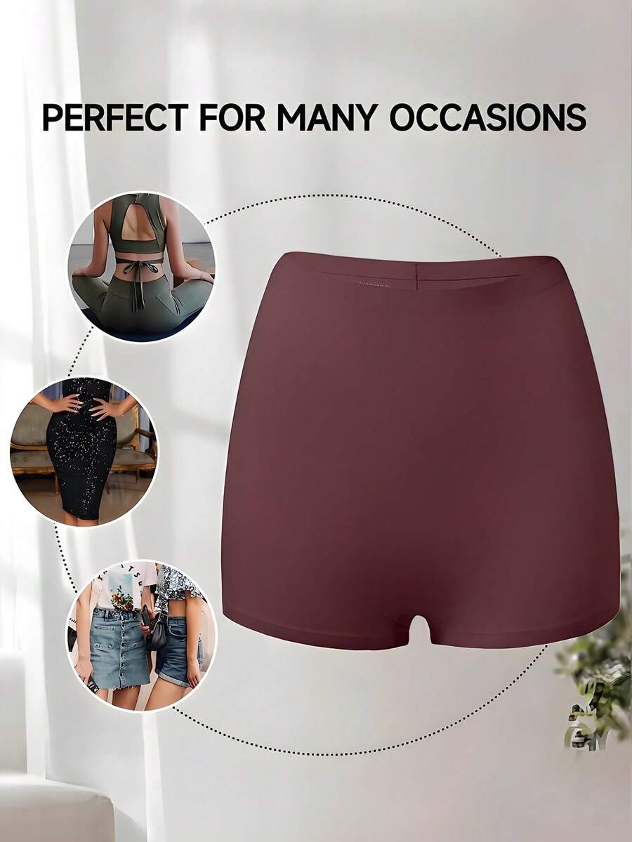 Women's black high stretch shapewear shorts with a mid waist fit and semi-sheer fabric.