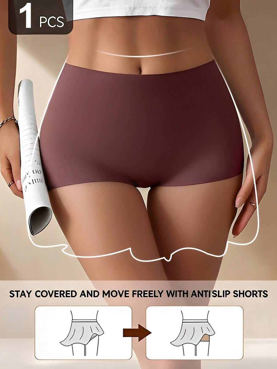 Women's black high stretch shapewear shorts with a mid waist fit and semi-sheer fabric.