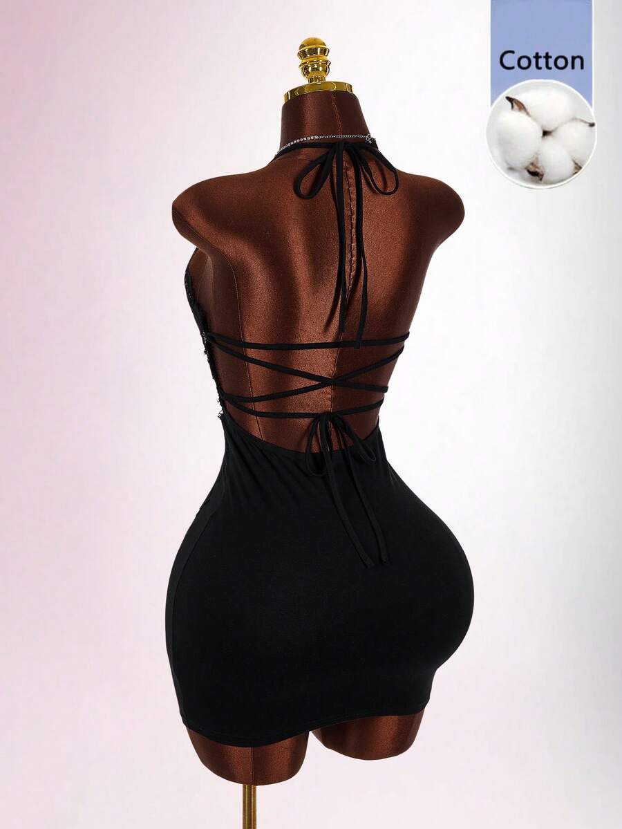 Black sleeveless lace trim bodycon mini dress featuring spaghetti straps, front cutout detail, and semi-sheer contrast lace accents on a slim fit knitted silhouette.