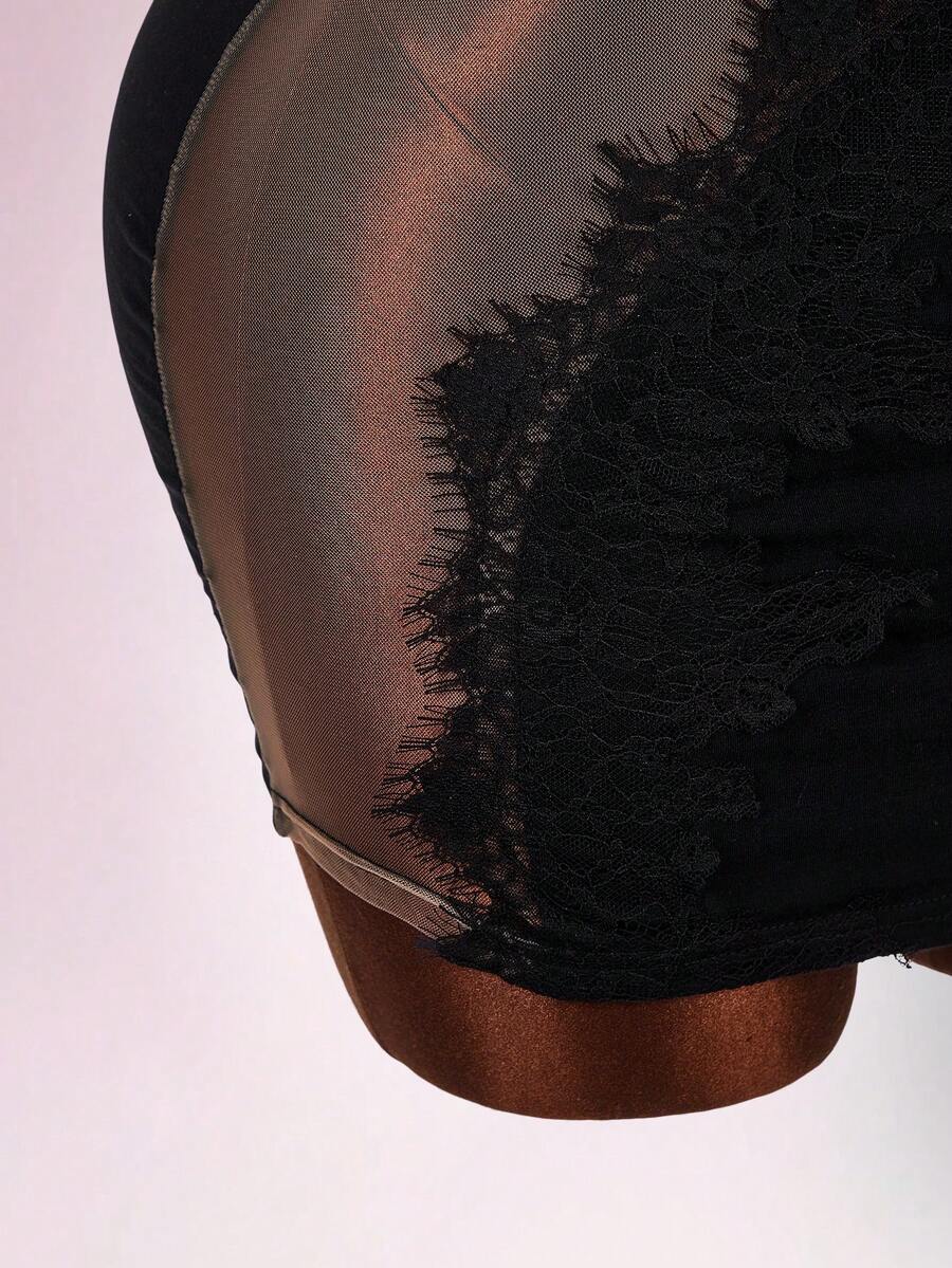 Black sleeveless lace trim bodycon mini dress featuring spaghetti straps, front cutout detail, and semi-sheer contrast lace accents on a slim fit knitted silhouette.