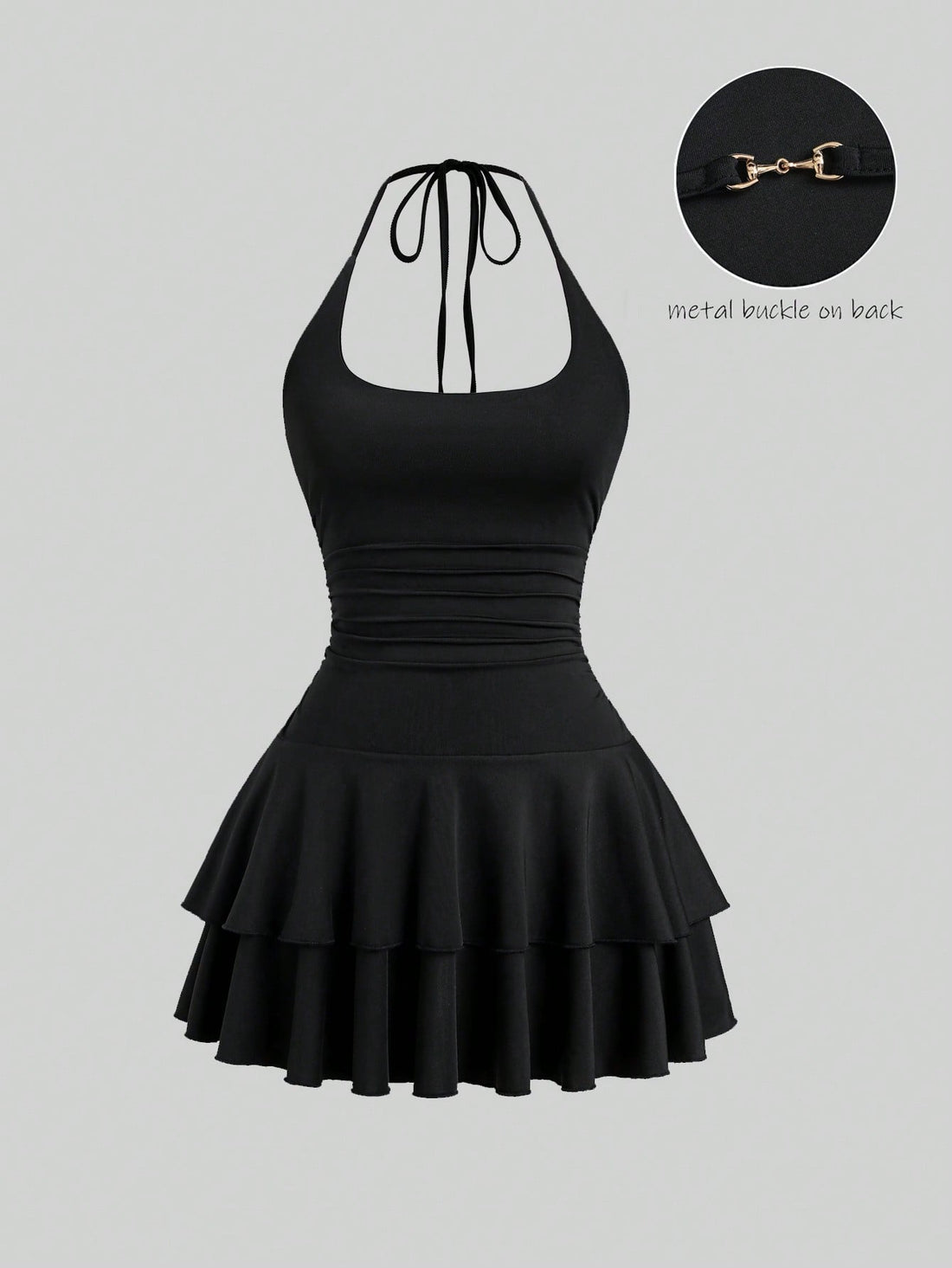 Black sleeveless tiered cami mini dress for women featuring a plain pattern, halter neckline, tie back detail, and layered hem.