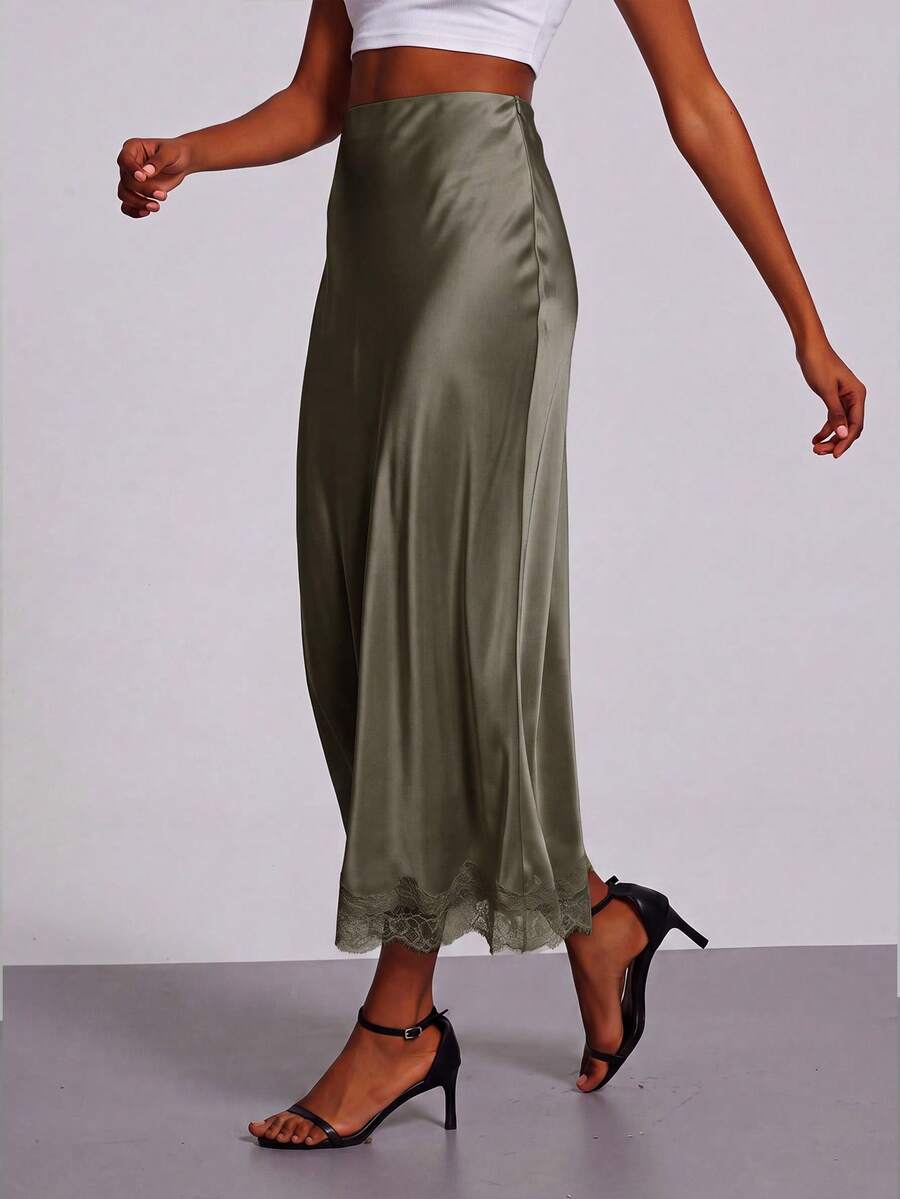 Women's black lace patchwork satin skirt featuring a long bodycon silhouette and natural mid waist design.