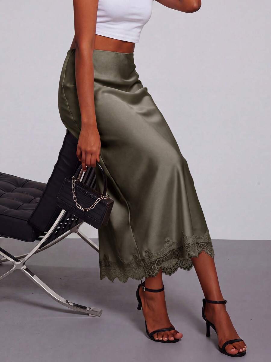 Women's black lace patchwork satin skirt featuring a long bodycon silhouette and natural mid waist design.