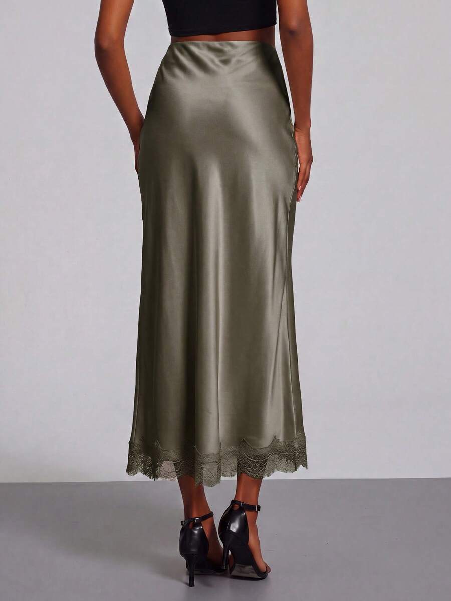 Women's black lace patchwork satin skirt featuring a long bodycon silhouette and natural mid waist design.