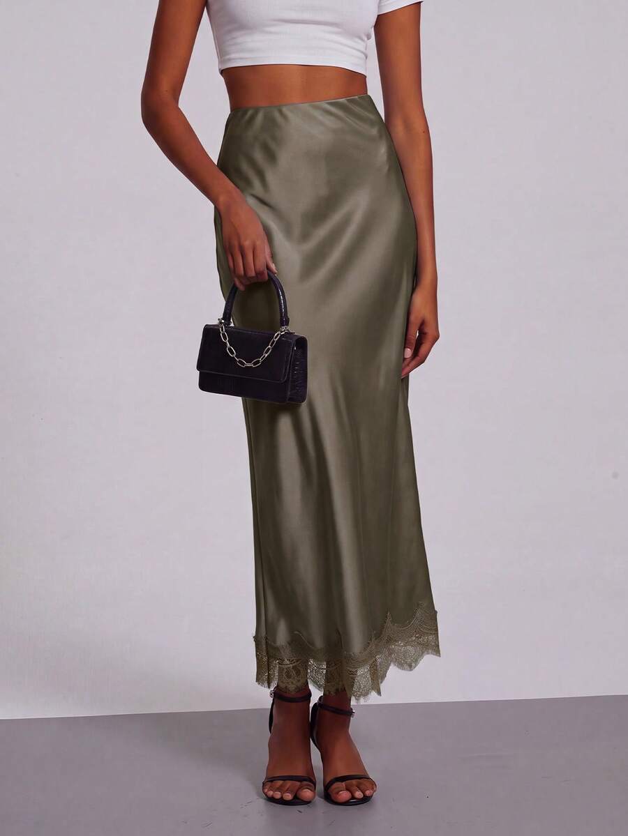 Women's black lace patchwork satin skirt featuring a long bodycon silhouette and natural mid waist design.
