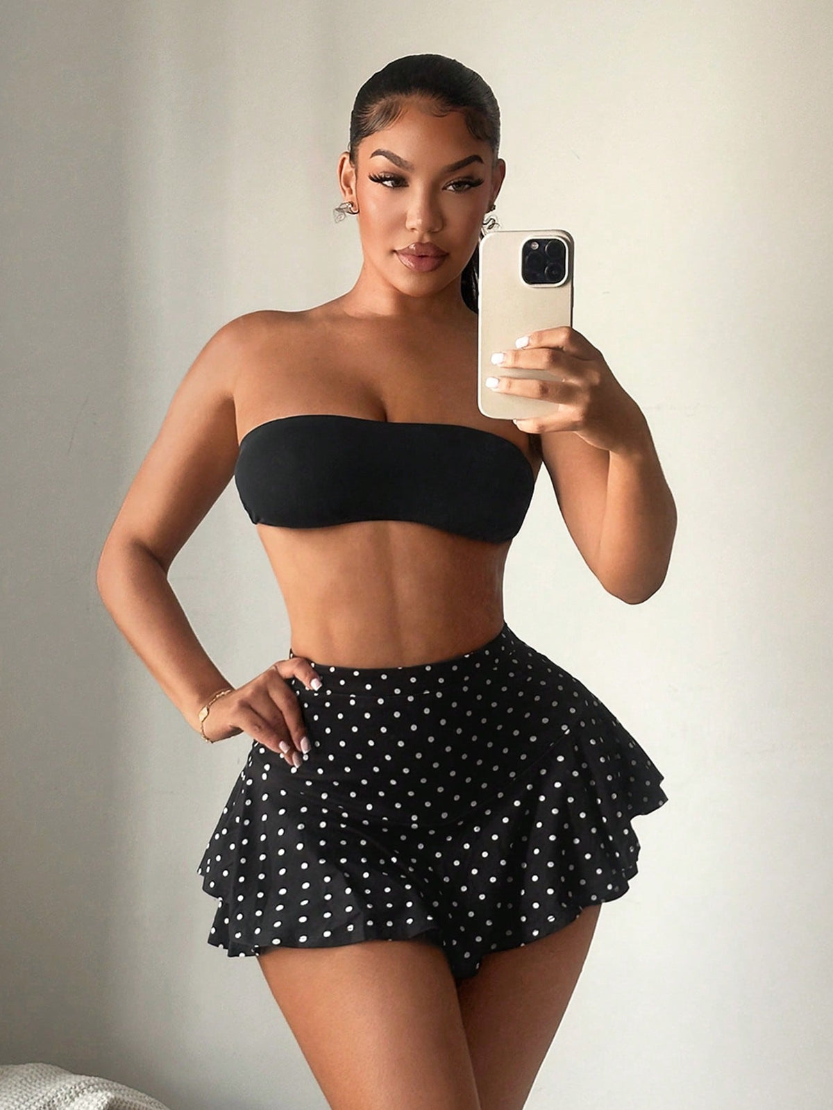 Black high waist ruffle hem skort for women featuring an elastic waistband and lined design.