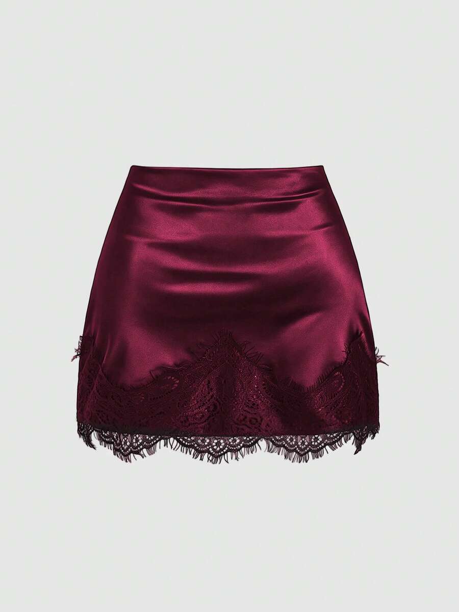 Black satin bodycon short skirt featuring contrast lace trim and mid-waist fit for women