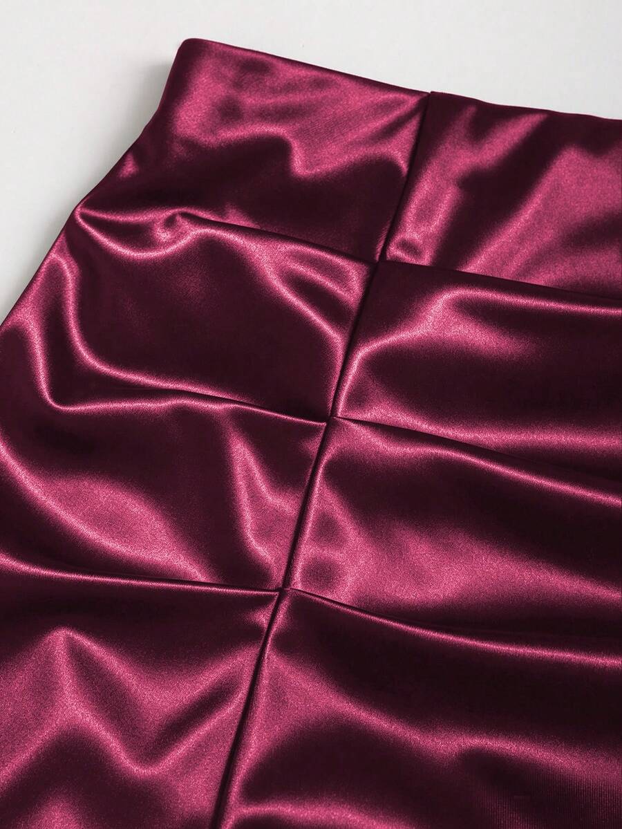 Black satin bodycon short skirt featuring contrast lace trim and mid-waist fit for women
