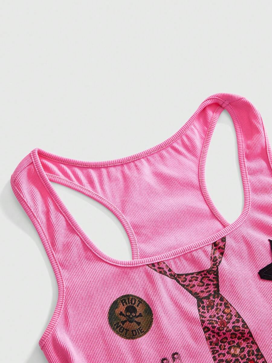 Women's white scoop neck camisole tank top featuring a badge patchwork print, front bow tie detail, cut-out accents, and slim-fit cotton stretch fabric.