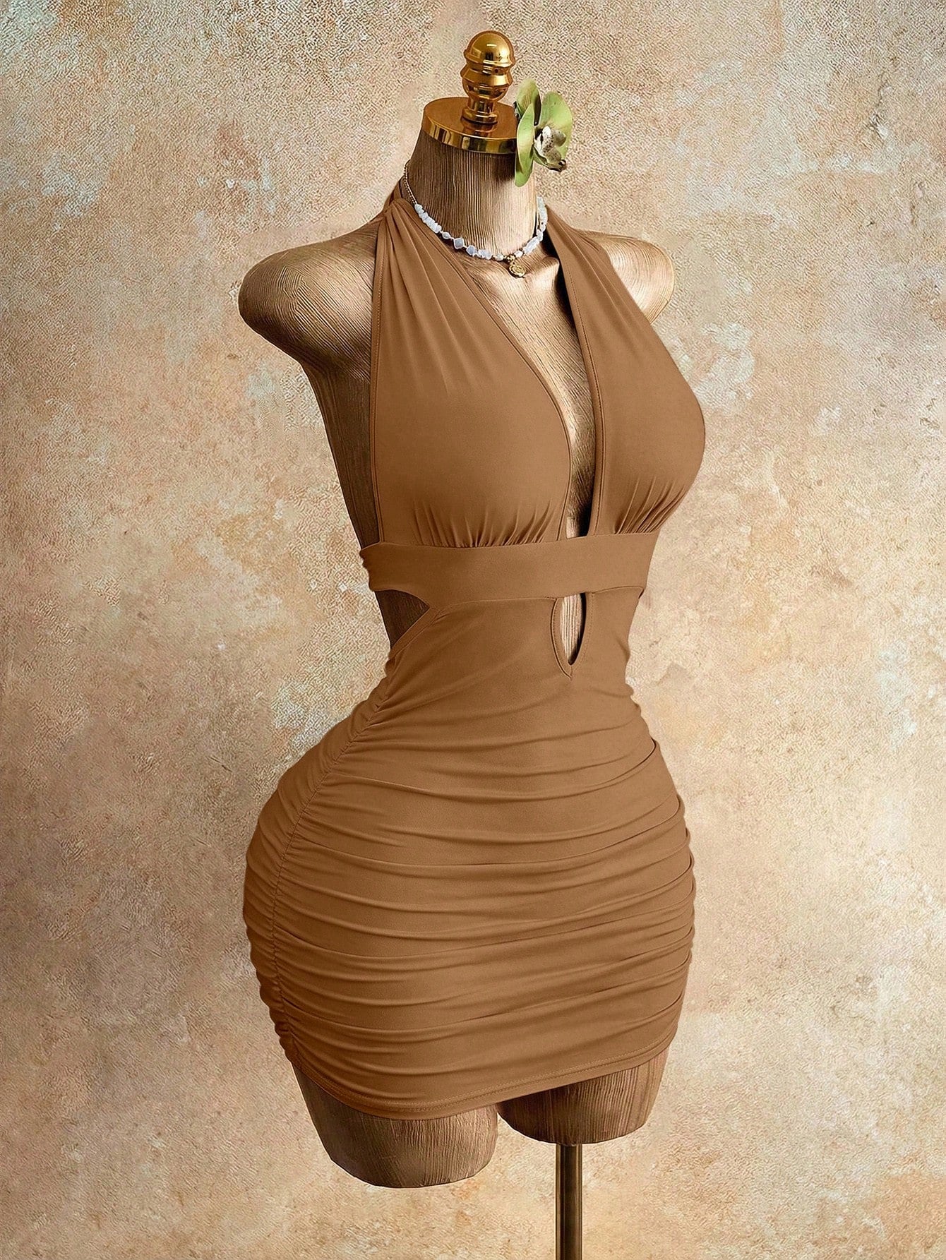 Sleeveless women's halter backless bodycon mini dress featuring lace-up knot back details and a high-waist pencil hem.