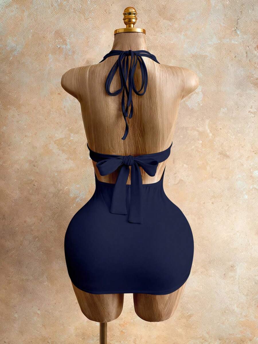 Sleeveless women's halter backless bodycon mini dress featuring lace-up knot back details and a high-waist pencil hem.