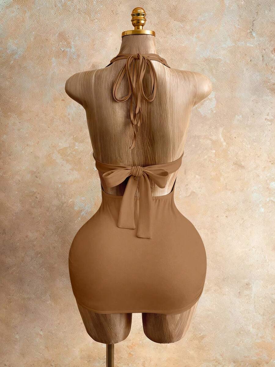 Sleeveless women's halter backless bodycon mini dress featuring lace-up knot back details and a high-waist pencil hem.
