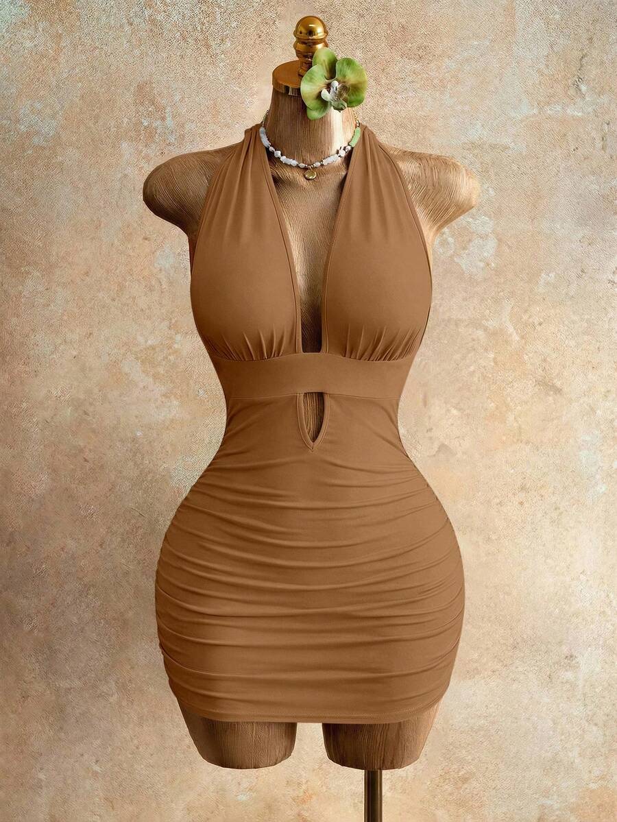 Sleeveless women's halter backless bodycon mini dress featuring lace-up knot back details and a high-waist pencil hem.