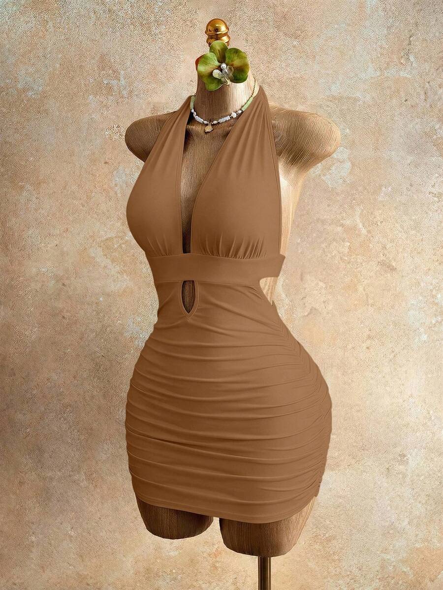 Sleeveless women's halter backless bodycon mini dress featuring lace-up knot back details and a high-waist pencil hem.