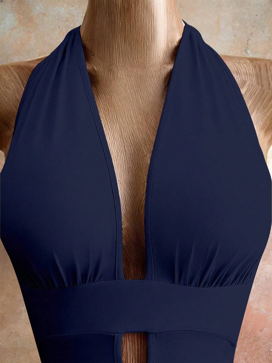 Sleeveless women's halter backless bodycon mini dress featuring lace-up knot back details and a high-waist pencil hem.