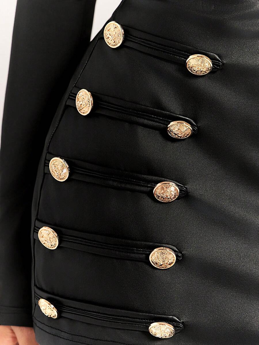 Women's black bodycon mini skort featuring a low waist, pleated side split hem, zipper closure, and built-in shorts.