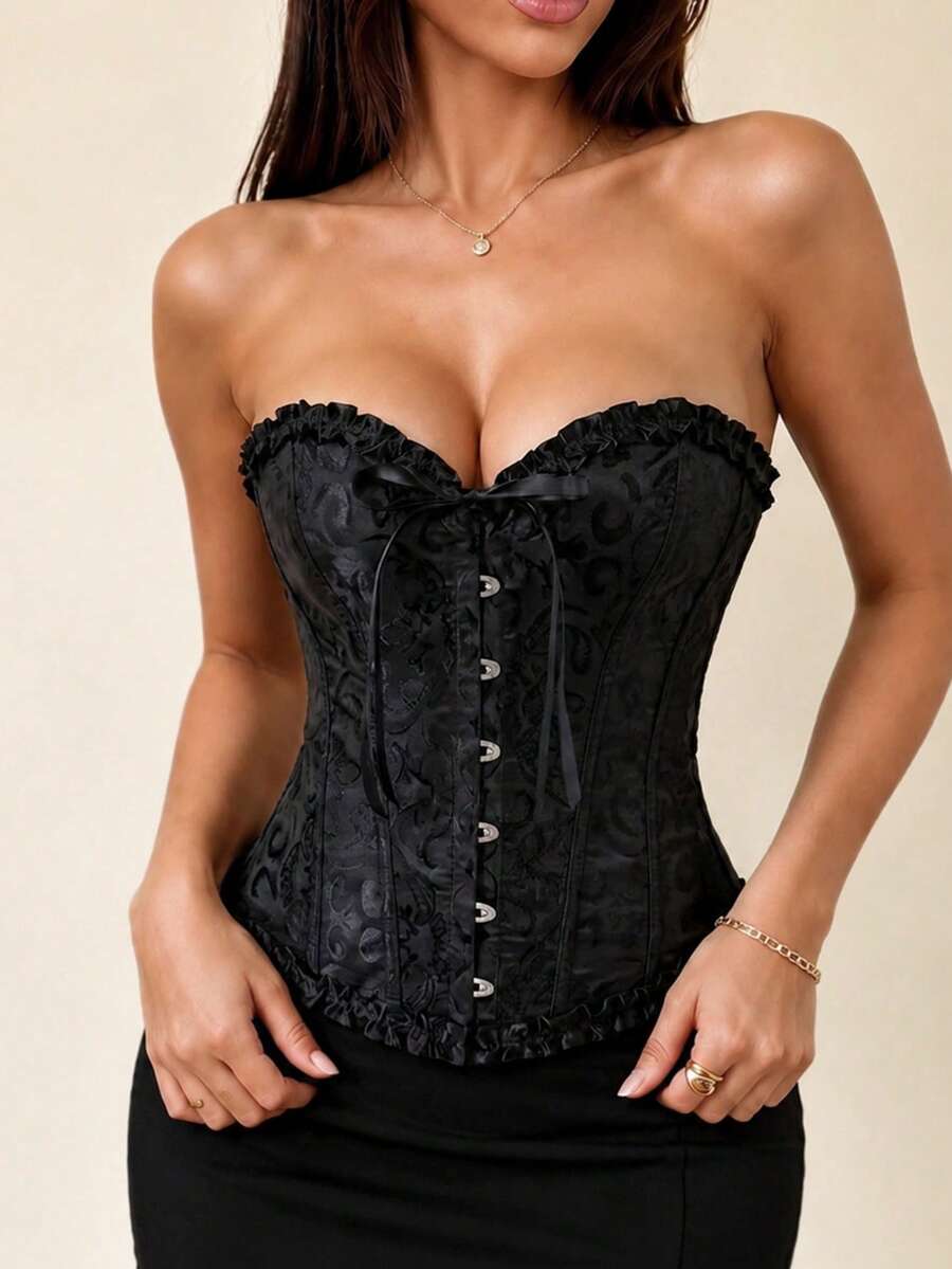 Pink strapless corset top with front hook-and-eye closure, grommet eyelet lace-up back, and frill detailing paired with a matching thong.