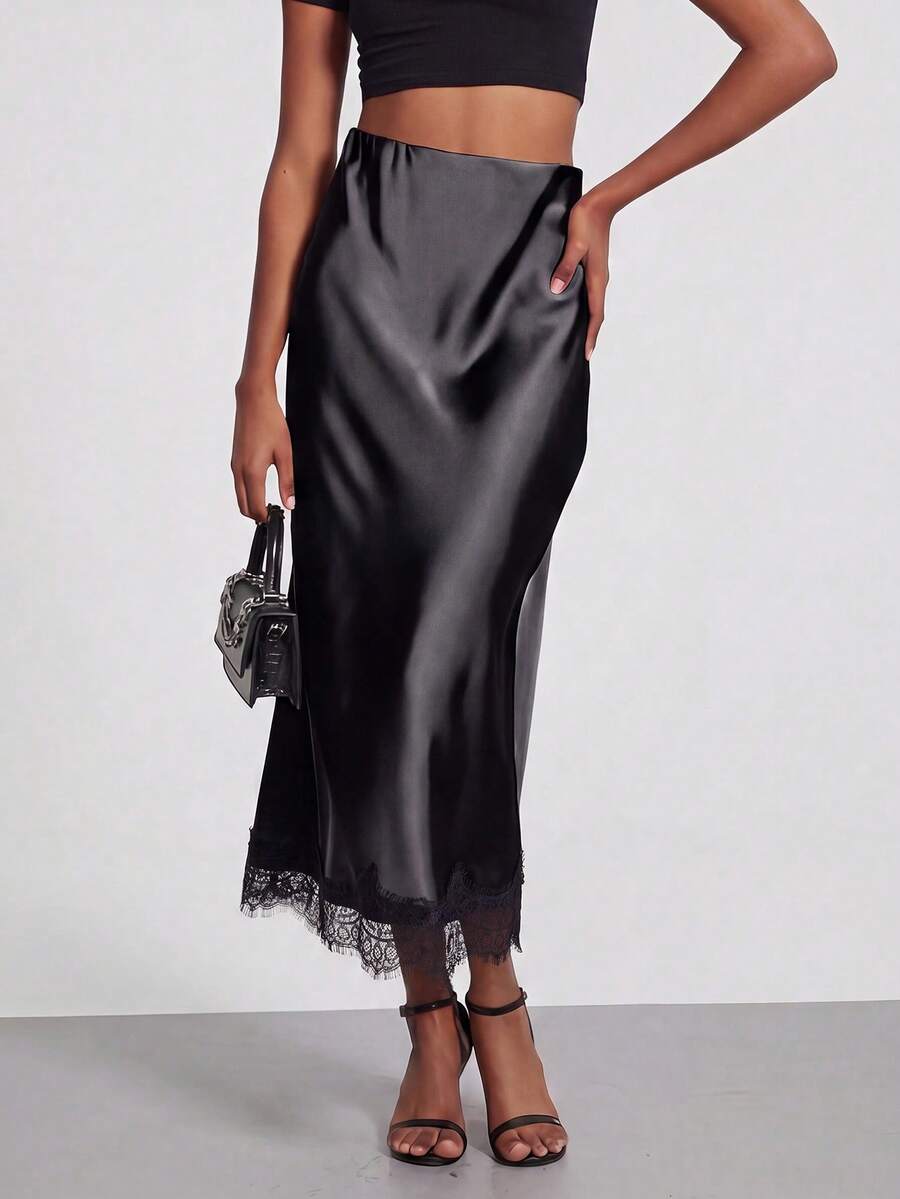 Women's black lace patchwork satin skirt featuring a long bodycon silhouette and natural mid waist design.